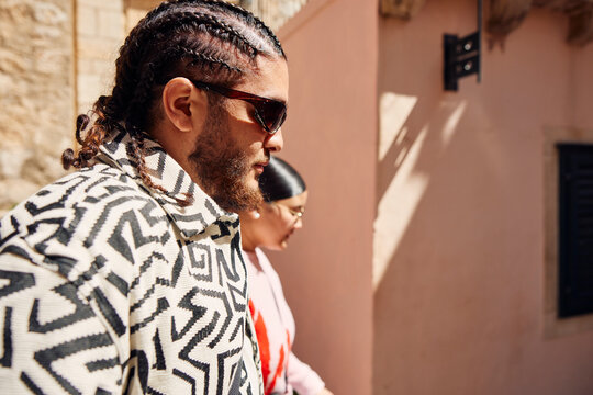 Portrait of a man with cornrows