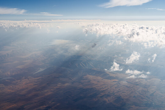 Sunrays shining through light clouds