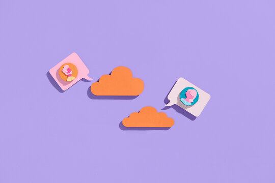 colorful icons around a orange cloud in a color background - Powered by Adobe
