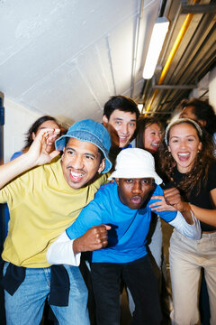 Group of happy and excited young people celebrating victory