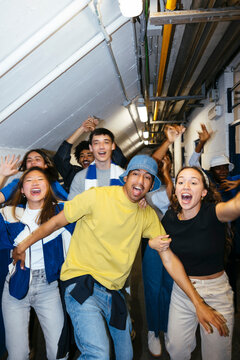 Group of happy and excited young people celebrating victory