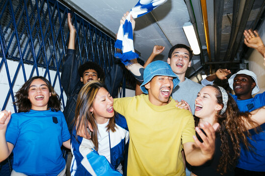 Group of happy and excited young people celebrating victory