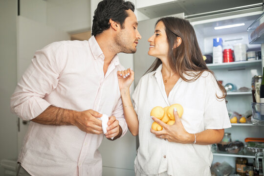 pregnant woman with husband doing daily chores at home