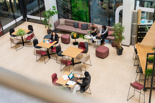 Business Meeting In Open Office - Powered by Adobe