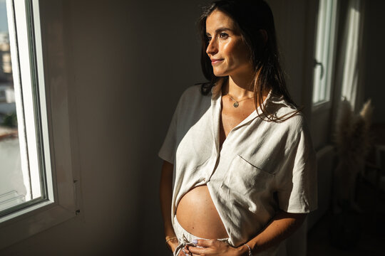 portrait of pregnant woman at home