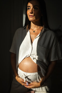 portrait of pregnant woman at home
