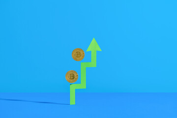 Bitcoin Concept With Rising Arrow On Blue Background