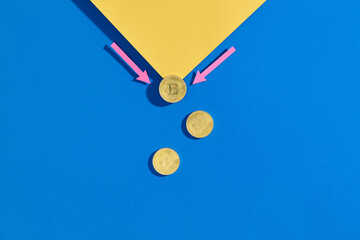 Bitcoin Concept with Arrows and Coins on Blue and Yellow Background