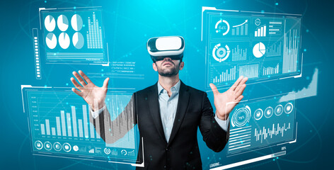Skilled business man looking data analysis while planning strategy by using visual reality glasses. Professional smart investor checking financial graph holographic while wearing VR goggle. Deviation.
