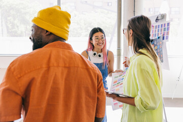 Creative team discussing color palette and design ideas