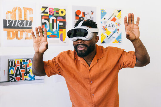 Man experiencing virtual reality with VR headset in art studio
