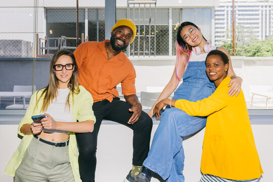 Cheerful group of friends enjoying time together indoors