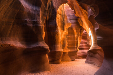 Large hallway with sun illuminating Upper Antelope Canyon