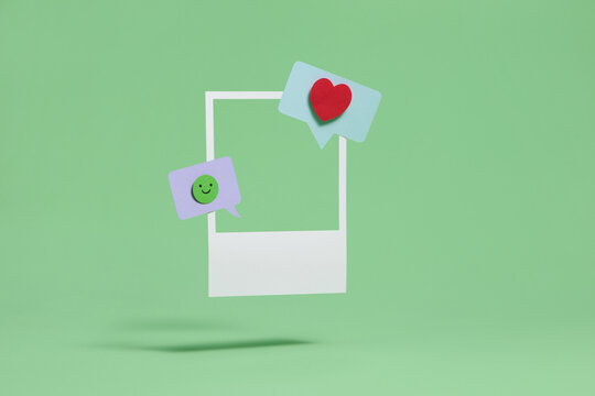 Social Media Concept with Heart and Smiley Icons on Green Background