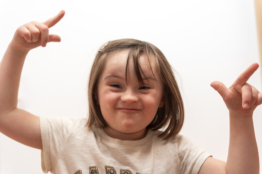 Girl With Down Syndrome Making Silly Faces


