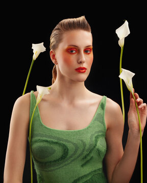 The portrait of a girl with white calla lilies.
