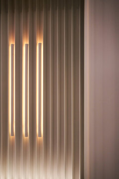 Neon-lit wall in the interior of a futuristic restaurant