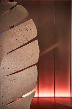 Neon-lit wall in the interior of a futuristic restaurant
