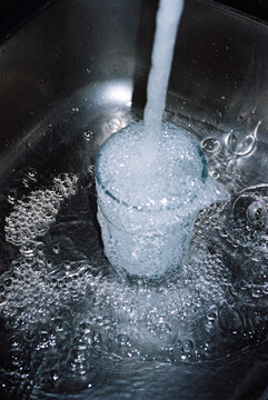 Glass cup overflow with water