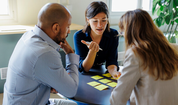 Business team having meeting using adhesive notes at office