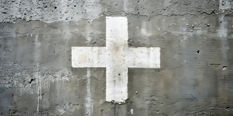 A bright white plus sign (+) boldly painted on a weathered, gray cement wall, symbolizing positivity, addition, and growth in a gritty urban environment.