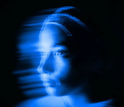 Blurred Portrait of a Muslim Woman with Blue Light