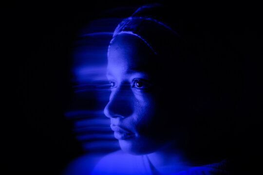 Blurred Portrait of a Muslim Woman with Blue Light