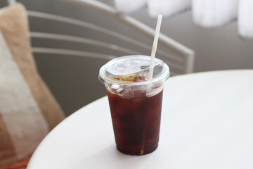 cup of iced coffee on a white table.
