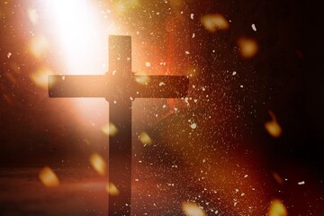 Silhouette of wooden cross inside antique church