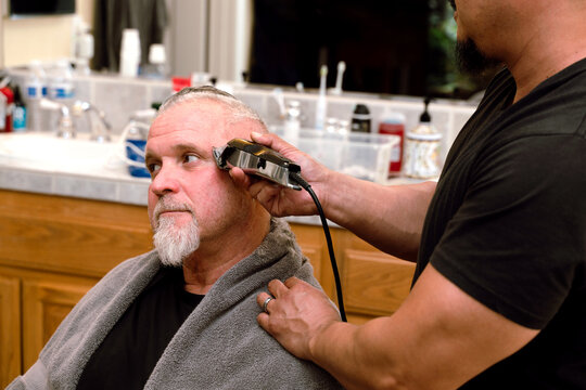  Man Receiving Haircut with Electric Clipper