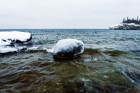 Rock covered in ice in Lake Superior
