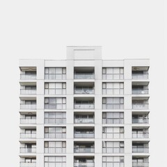 Modern Architectural Design of a White Apartment Building in an Urban Setting at Midday