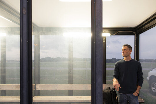 Man in Airport Shuttle Bus Stop