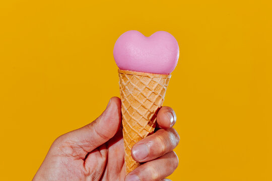 man with a heart-shaped ice cream cone