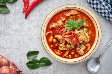 Panaeng pork curry,,Panaeng Curry with Pork in a ceramic bowl on cement background
