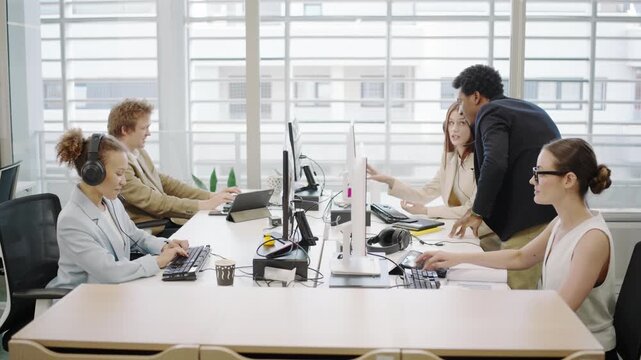 A scene of business professionals collaborating in a modern office, highlighting teamwork and communication among diverse employees, fostering productivity and successful interactions