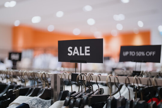 Sale Sign in Clothing Store