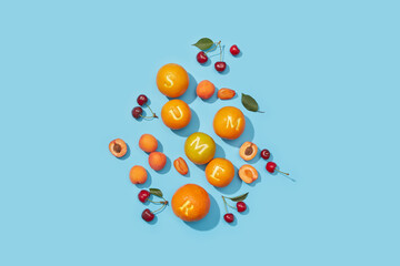 Ripe fruits scattered randomly and creating summer word