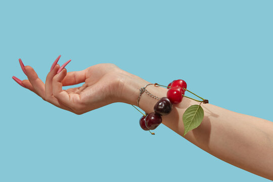 Handmade bracelet made of cherry beads around wrist 