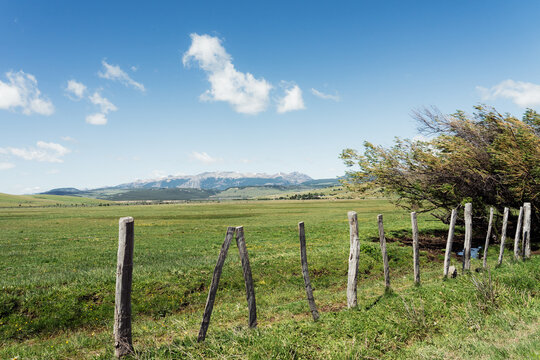 Bright blue sky over green field