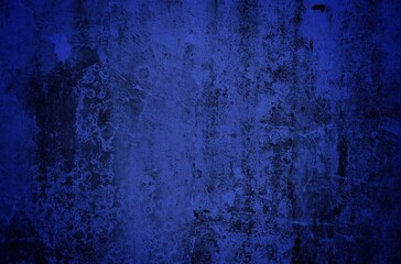 Old cracked wall background, dirty grunge texture. Paint peeling plaster walls. the cement walls are broken blue paint and peel off the paint