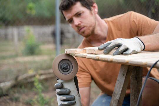 man doing carpentry work for the house