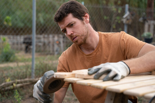 man doing carpentry work for the house