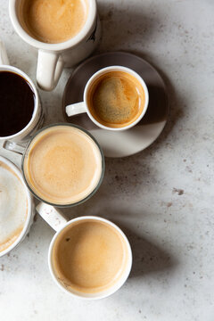 Overhead image of six cups of coffee