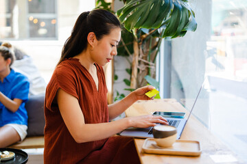 Woman Shopping Online Using Laptop