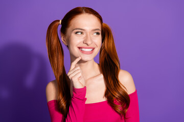 Photo portrait of lovely young lady look interested empty space dressed stylish pink garment isolated on violet color background