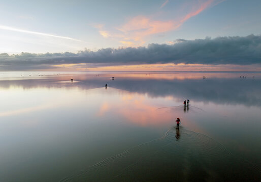 Infinity sea beach with calm water surface.