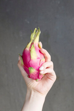 Dragonfruit/pitahaya and concrete wall with hard direct flashlight