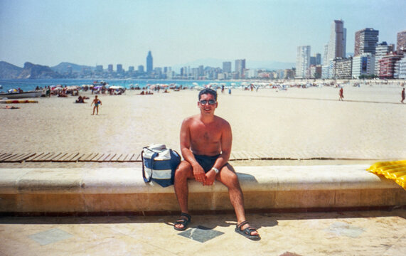 Analog portrait of a man on the beach in Benidorm, Spain in the 90s