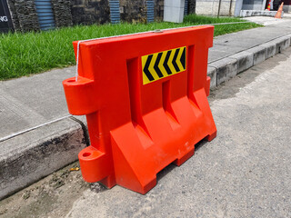 Orange barrier water is used to limit vehicle entry and exit access
